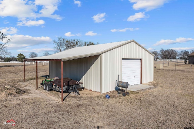 view of outdoor structure featuring a garage and a carport