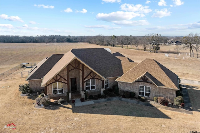 view of front of house with a rural view