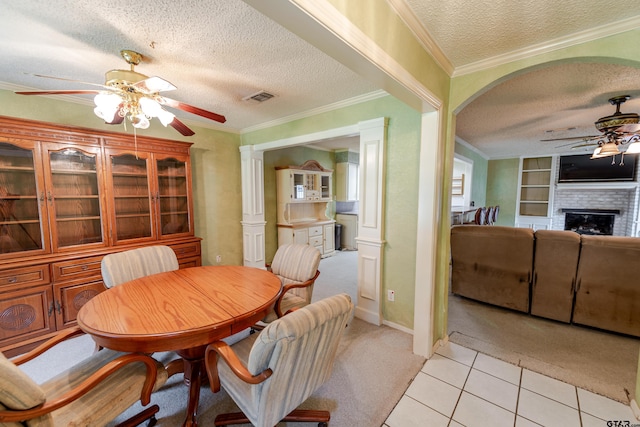 102 King Henry Rd, Scroggins, TX 75480 - dining room featuring a textured ceiling, visible vents, ceiling fan, ornamental molding, and light carpet