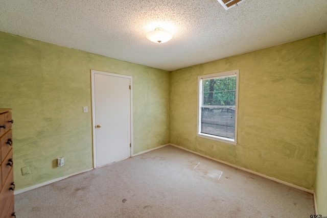 102 King Henry Rd, Scroggins, TX 75480 - unfurnished bedroom with carpet floors and a textured ceiling