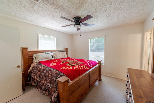 102 King Henry Rd, Scroggins, TX 75480 - bedroom with a textured ceiling, ceiling fan, and light carpet