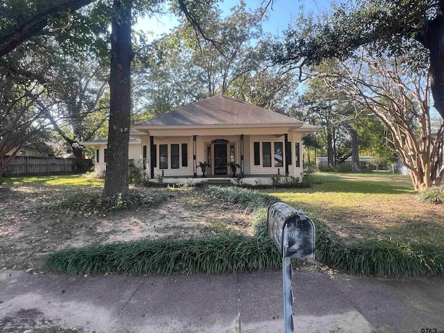 view of front facade with a porch and a front lawn