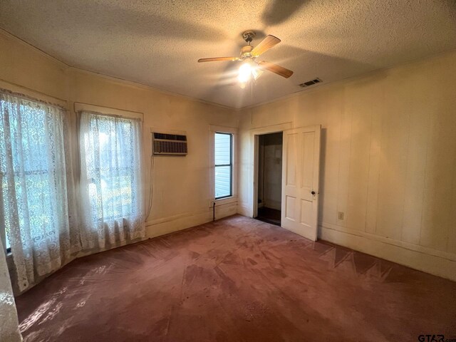 625 S Buffalo St, Canton, TX 75103 - unfurnished bedroom featuring a textured ceiling, carpet flooring, ceiling fan, an AC wall unit, and ornamental molding