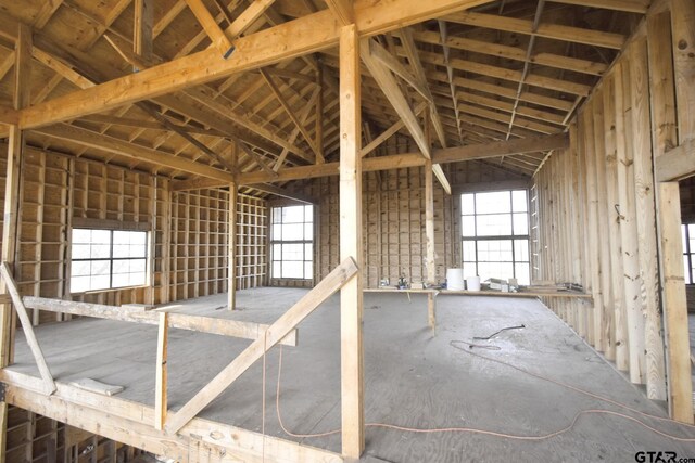 miscellaneous room featuring high vaulted ceiling