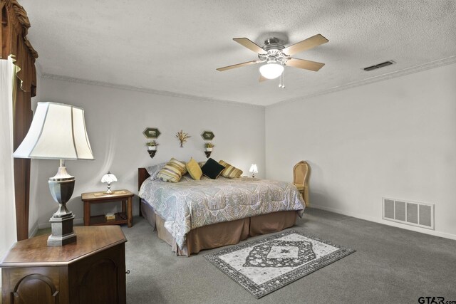 carpeted bedroom featuring ceiling fan and a textured ceiling