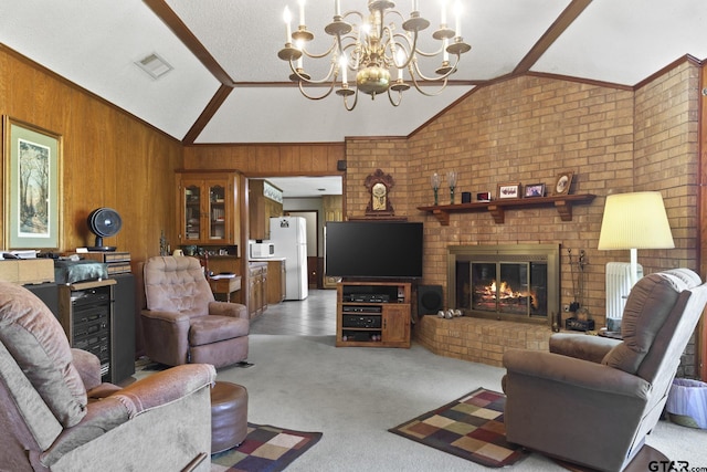 living room with carpet flooring, a brick fireplace, an inviting chandelier, lofted ceiling, and wood walls