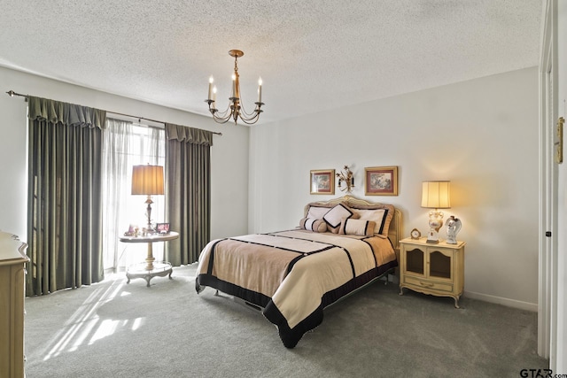 carpeted bedroom with a textured ceiling and a chandelier