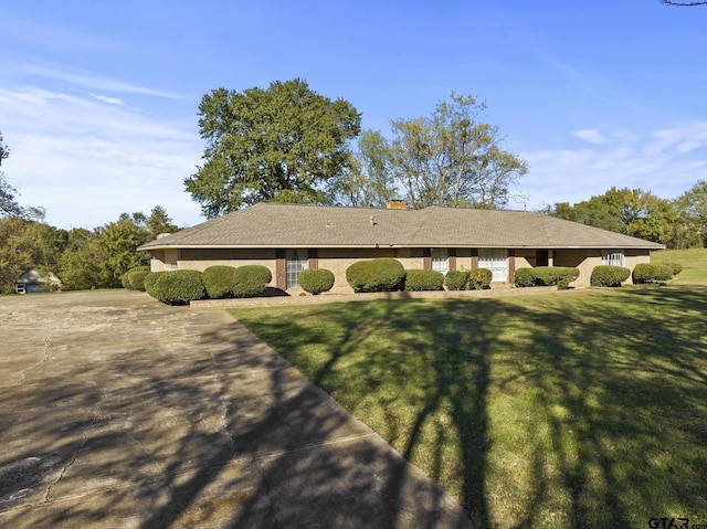 view of side of home featuring a lawn