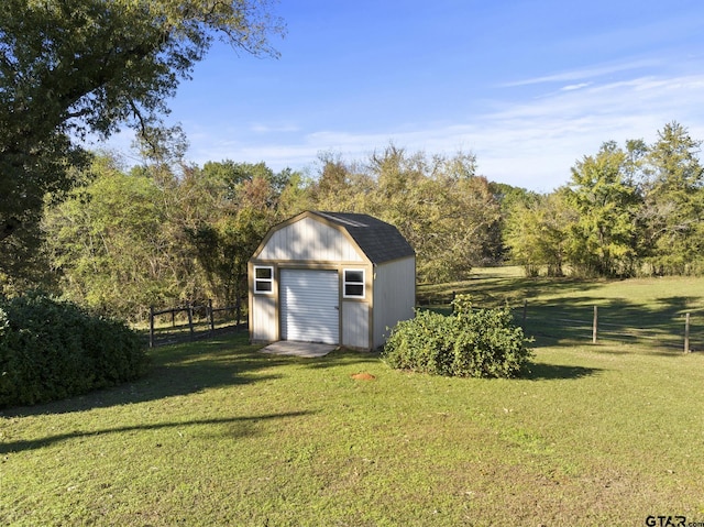 view of outdoor structure featuring a yard