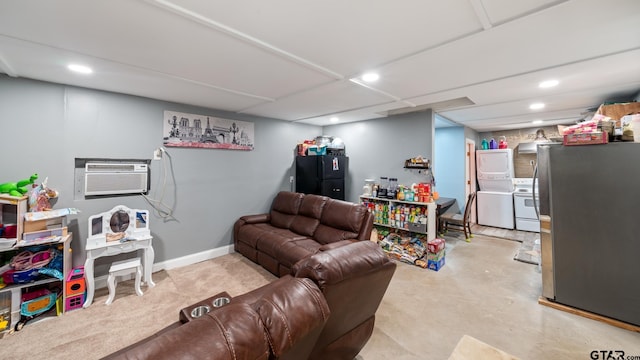 living room with stacked washer and clothes dryer and a wall mounted AC