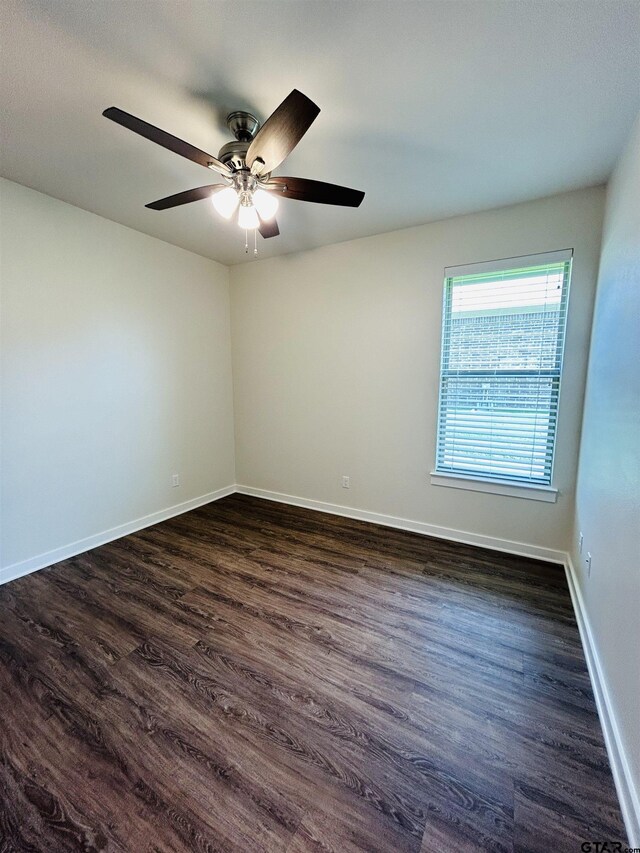 15033 High Country Acres Ln, Tyler, TX 75706 - spare room featuring dark wood-style floors and a ceiling fan