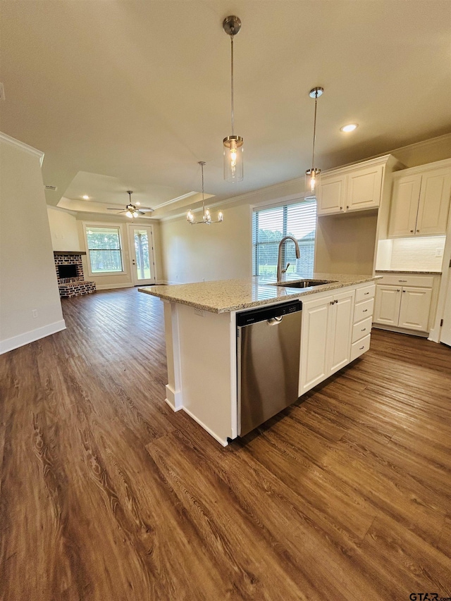 15033 High Country Acres Ln, Tyler, TX 75706 - kitchen featuring stainless steel dishwasher, open floor plan, dark wood finished floors, a kitchen island with sink, and white cabinets