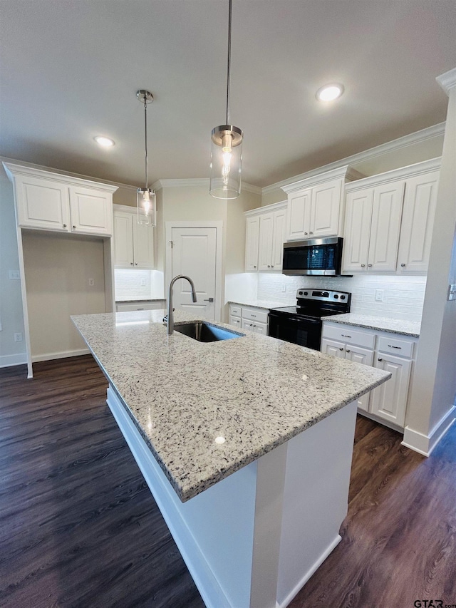 15033 High Country Acres Ln, Tyler, TX 75706 - kitchen with black range with electric stovetop, stainless steel microwave, crown molding, white cabinetry, and dark wood-type flooring