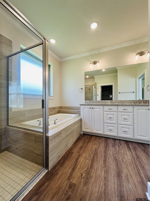 15033 High Country Acres Ln, Tyler, TX 75706 - full bath featuring a garden tub, double vanity, wood finished floors, crown molding, and a shower stall