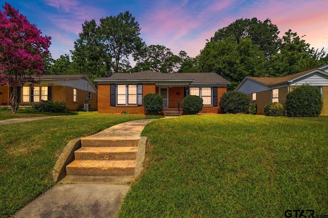 1931 S Wiley, Tyler, TX 75701 - ranch-style house featuring a lawn and brick siding