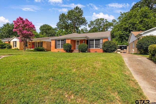 1931 S Wiley, Tyler, TX 75701 - ranch-style house with a front yard, brick siding, concrete driveway, and crawl space