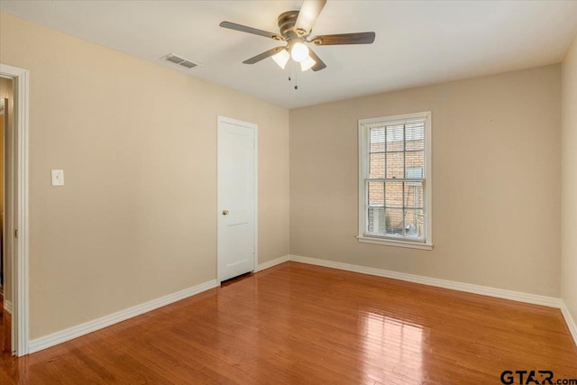 1931 S Wiley, Tyler, TX 75701 - unfurnished room featuring a ceiling fan and wood finished floors