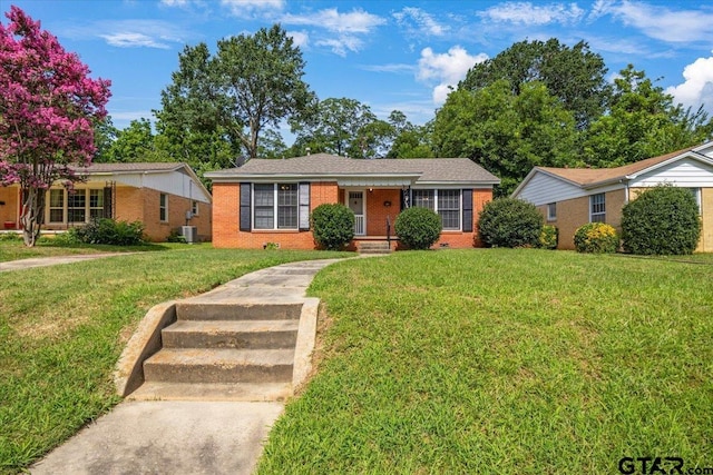 1931 S Wiley, Tyler, TX 75701 - ranch-style home featuring brick siding and a front yard