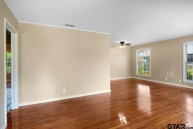 1931 S Wiley, Tyler, TX 75701 - empty room featuring wood finished floors, a ceiling fan, and ornamental molding