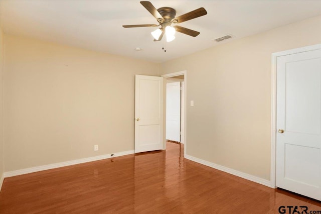 1931 S Wiley, Tyler, TX 75701 - spare room with wood finished floors and a ceiling fan