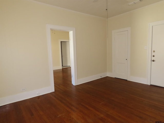 empty room featuring dark wood-type flooring