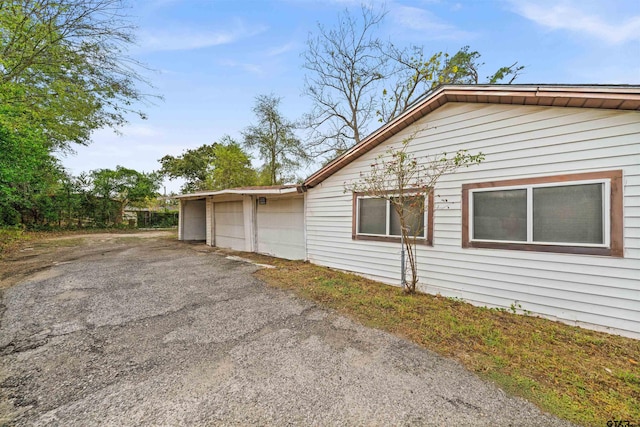 view of side of property with a garage