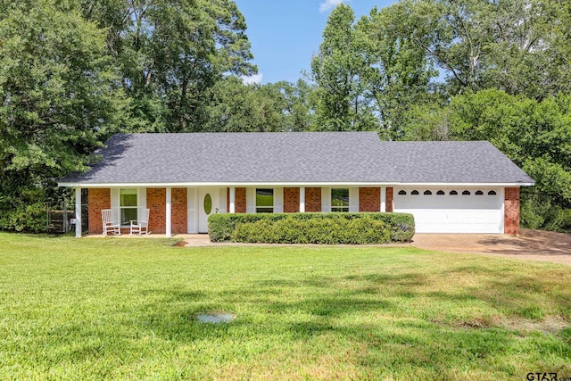 312 Savannah Dr, Tyler, TX 75703 - ranch-style house featuring a garage, brick siding, a front yard, driveway, and a shingled roof