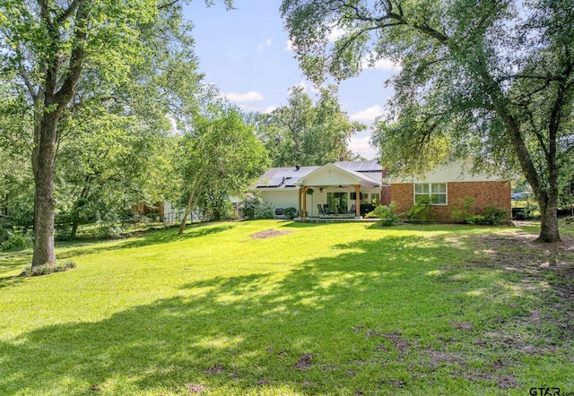 312 Savannah Dr, Tyler, TX 75703 - view of grassy yard featuring ceiling fan