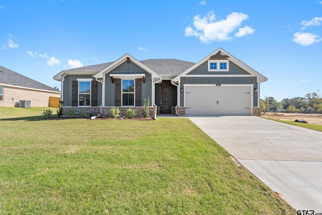 craftsman inspired home featuring a front yard, central AC, and a garage