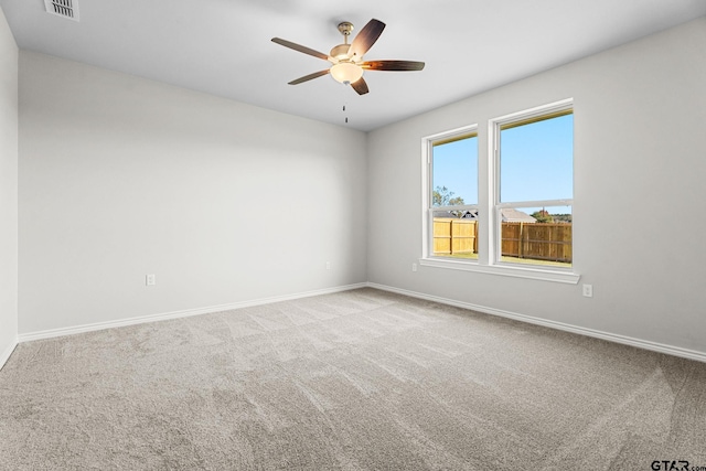 carpeted empty room with ceiling fan