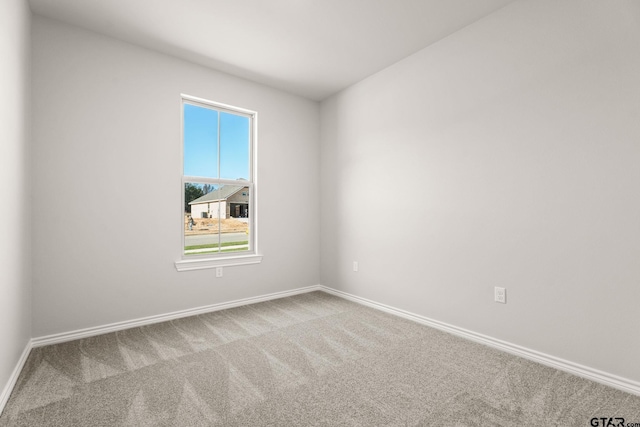 unfurnished room featuring carpet