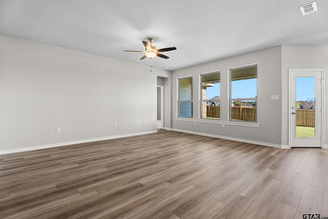 spare room featuring ceiling fan and light hardwood / wood-style floors