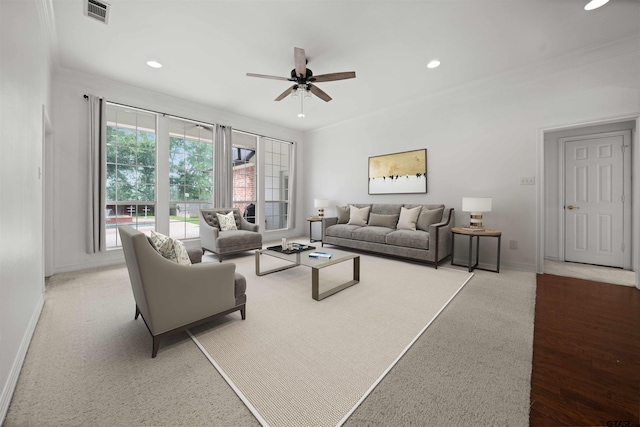 2107 Baylor Dr, Jacksonville, TX 75766 - carpeted living room with baseboards, ceiling fan, recessed lighting, and ornamental molding
