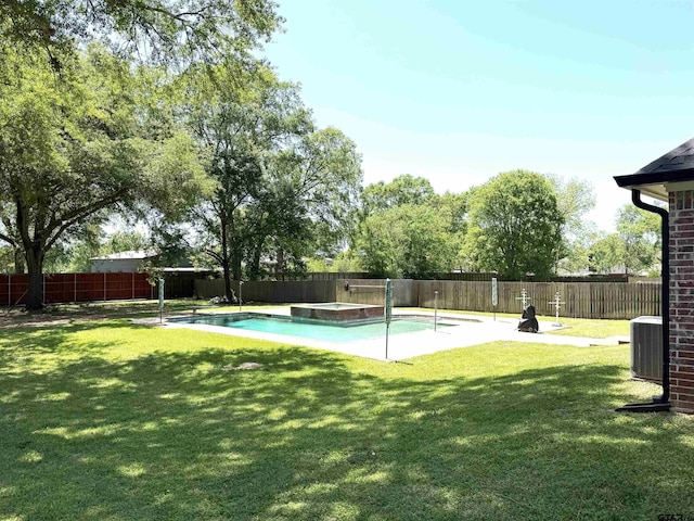 2107 Baylor Dr, Jacksonville, TX 75766 - view of swimming pool featuring central air condition unit and a pool with connected hot tub