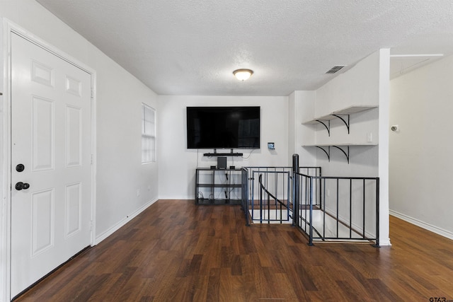 371 Shadybrook Dr, Bullard, TX 75757 - corridor with an upstairs landing, wood finished floors, a textured ceiling, and baseboards