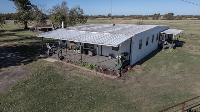 765 Rs County Road 3410, Emory, TX 75440 - view of side of property featuring a metal roof, a lawn, and a rural view