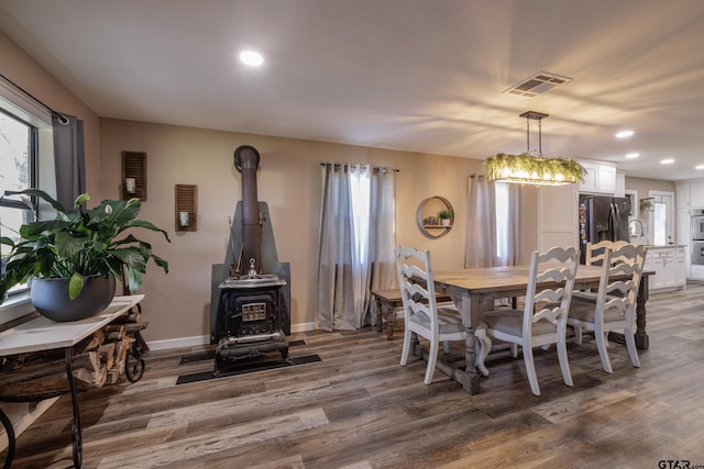 765 Rs County Road 3410, Emory, TX 75440 - dining room with a wood stove, wood finished floors, recessed lighting, and healthy amount of natural light