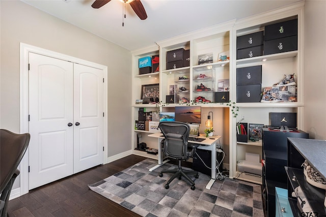 home office with dark hardwood / wood-style flooring and ceiling fan