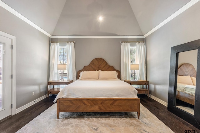 bedroom with dark wood-type flooring, multiple windows, and vaulted ceiling