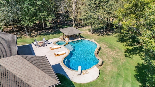 view of pool featuring a diving board, a lawn, a patio, and a gazebo