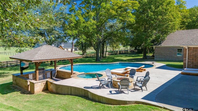 view of pool with a yard, a patio, a gazebo, and an in ground hot tub