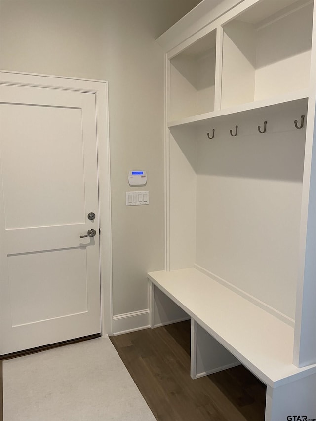 mudroom with dark hardwood / wood-style floors