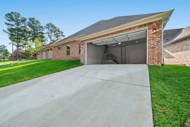 view of side of home featuring a garage and a yard