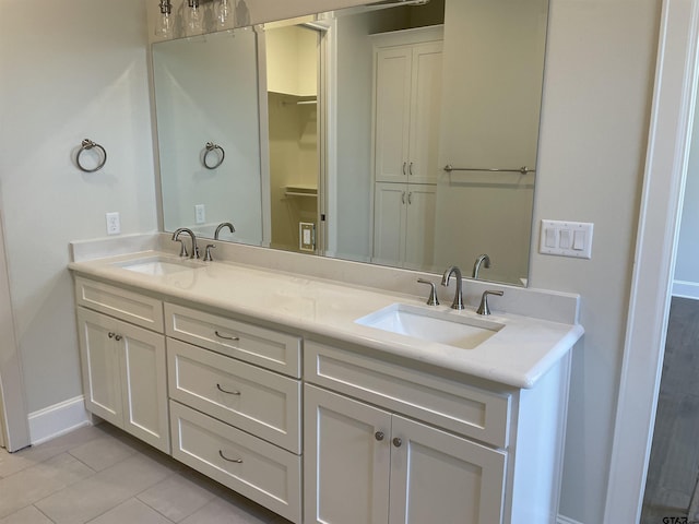 bathroom featuring tile patterned floors and vanity