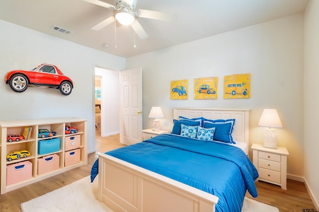 bedroom featuring light wood-type flooring and ceiling fan