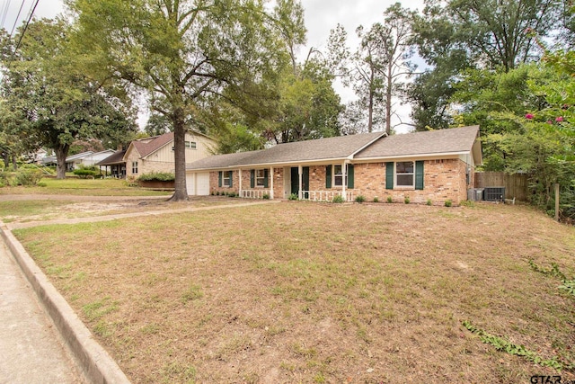 single story home featuring central air condition unit and a front yard