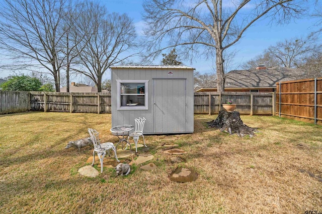 view of shed with a fenced backyard