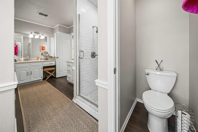 full bath featuring visible vents, a stall shower, vanity, and wood finished floors