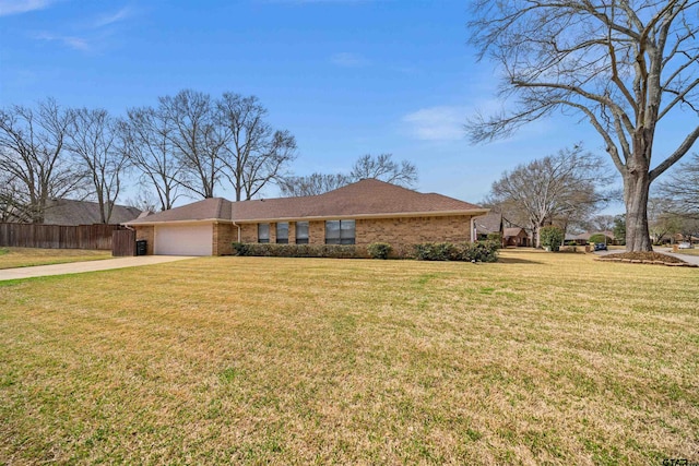 single story home featuring brick siding, fence, a front yard, driveway, and an attached garage