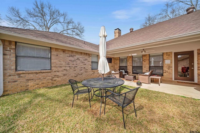 view of yard with an outdoor living space and a patio